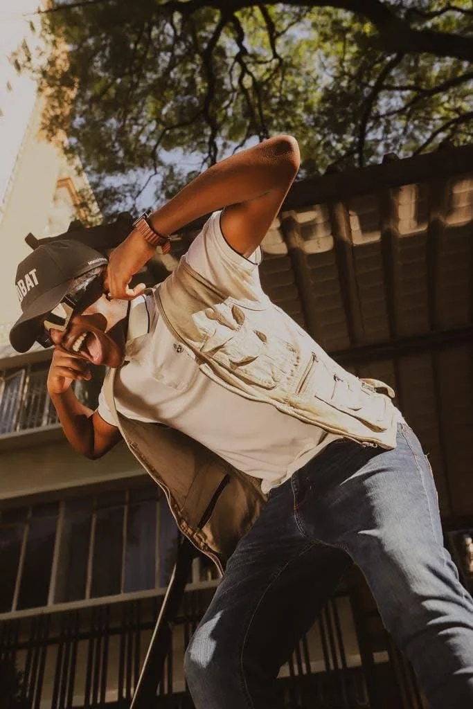 Vapour, shot from below against a Johannesburg apartment block